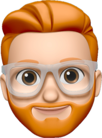 A 3D-rendered emoji-style avatar of Tom Linford-Grayson with light skin, orange hair, and a well-groomed beard. The character wears clear-framed glasses and has a friendly expression with large, expressive brown eyes and a slight smile.